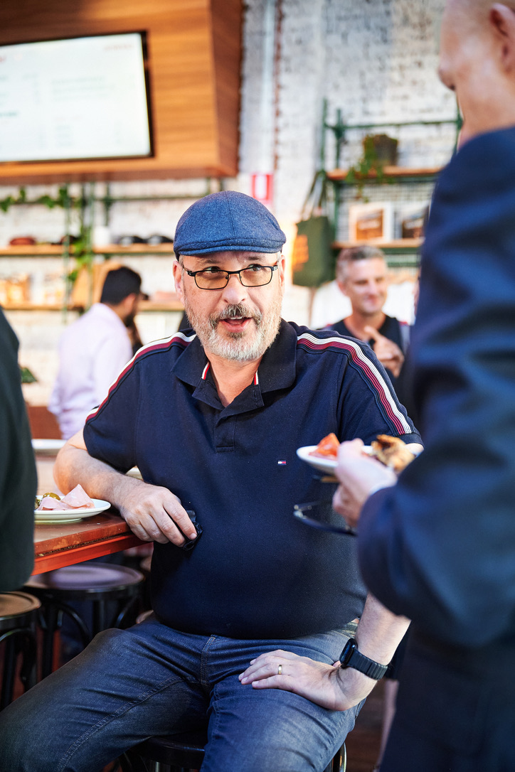 David Wilson in conversation at a networking event